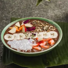 A smoothie bowl is my favorite way to start the day. This one is full of flavor and texture, with a rich smoothie base topped with fresh fruits, chia seeds, and our homemade granola. It's nature's broom, cleansing and energizing you.