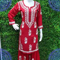 A vibrant red kurti with dense white Chikankari work around the neckline and scattered motifs all over. This piece can be stitched to your measurements for the perfect fit.