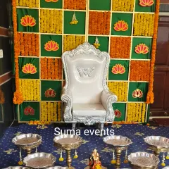 For a traditional baby shower or Seemantha, I set up a special throne for the mother-to-be. The backdrop here is made with a grid of fresh marigolds and auspicious lotus motifs.