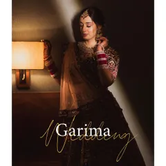 A beautifully designed portrait with the bride's name, perfect for a wedding album cover, showcasing her elegance in moody lighting.