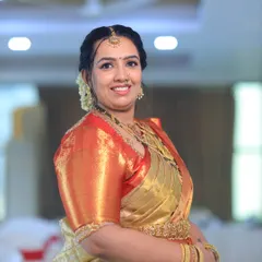 The lovely Chandana, looking stunning for her son's naming ceremony. I provided the complete service: flawless makeup, an elegant hairstyle, and traditional saree draping.