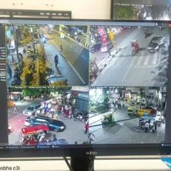 A four-camera split-screen view monitoring a busy city intersection at night. My installations for public spaces are designed to capture clear details of vehicles and pedestrian movement.