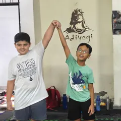 Two training partners celebrating a good session. The bonds formed on the mats are strong, built on mutual respect and shared hard work.