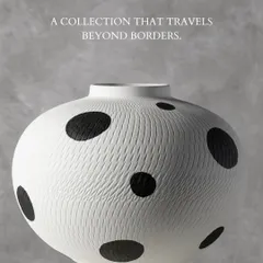 Inspired by global textiles, this black and white polka dot vase features a subtle, incised texture that invites a closer look. It is a playful yet sophisticated piece that travels effortlessly between different decor styles.