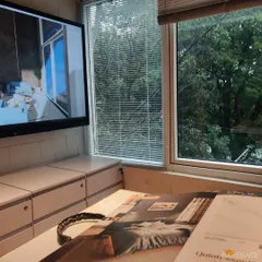 This is a point-of-view shot of our client collaboration process. Here, we are sitting with the client, comparing material samples to the 3D render on screen to ensure the final result perfectly matches the vision.