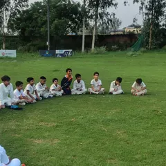 A young player confidently expresses his views during our group discussion. We encourage every trainee to participate and share their thoughts on strategy and gameplay.