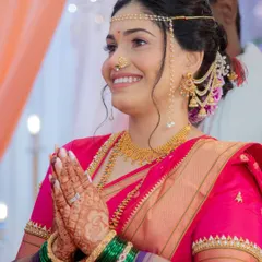 A moment of prayer during the wedding ceremony. The bride looks serene and beautiful with her Mundavalya and traditional attire.