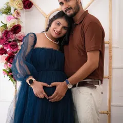 A classic couple pose, creating a heart shape over the baby bump. It’s a sweet and simple way to show the love and anticipation you share as you wait for your little one.