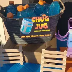A 'Chug Jug' drink station from a 'Fortnite' themed birthday party. This creative detail, inspired by the popular game, is always a huge hit with kids and gamers.