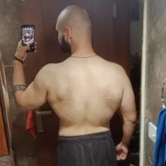 A different angle on my one year transformation, showing the changes in back definition and width. Don't chase perfection, chase CONSISTENCY.