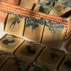 A close-up of our Hemp Help bars, ready to be wrapped. The earthy fragrance of rosemary, tea tree, and white tea makes it a calming treat for skin that needs a little extra love.
