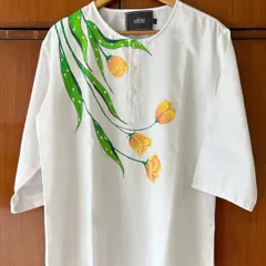 Art isn't just for walls. I hand-painted these delicate yellow tulips on a simple white linen kurta, creating a piece of unique wearable art. If you have a favorite garment, we can transform it into something truly special.
