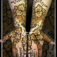 A full-coverage floral design that extends from the palms to the forearm. This style is perfect for guests who want a rich and detailed mehendi look.