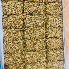 This tray is filled with my Almond & Walnut with Cinnamon bars, topped with toasted coconut flakes. The warm spice of cinnamon pairs beautifully with the crunchy nuts.