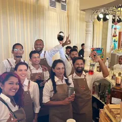 A candid moment with our diverse and energetic bartending team at a wedding event. This photo captures the fun and collaborative spirit of our crew, who work together to create a lively bar atmosphere.