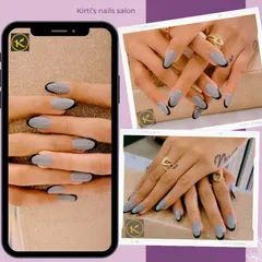This is a chic and modern take on the French manicure. I used a soft grey gel polish as the base on these almond-shaped extensions and created a crisp, black-tipped design for a sophisticated and edgy look.
