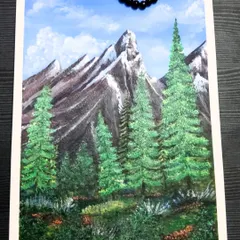 An acrylic painting of majestic, snow-capped mountains and lush pine trees. I used 200gsm paper for this piece to handle the layers of acrylic paint and capture the rugged texture of the landscape.