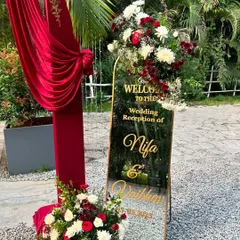 A personalized welcome for the happy couple. This custom mirrored sign with gold calligraphy adds a touch of modern elegance to the wedding reception entrance.