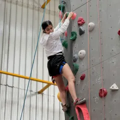 A climber enjoying a weekend session. Our gym is a place to find happiness, good vibes, and a great workout.