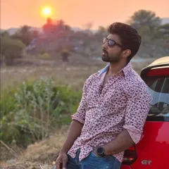 Leaning against my car at sunset. A moment of reflection on the road.