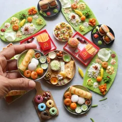 A fun flat lay of my most popular miniatures, including South Indian meals, vada pav, and donuts.