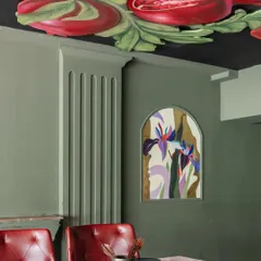 Looking up from the dining table, you see a modern fresco of juicy pomegranates and lilies. I was inspired by classical ceiling art but wanted to give it a fresh, vibrant feel that adds drama and a topic of conversation to the dining experience.