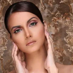 This is a classic 'straight makeup' look, designed for beauty and portfolio work. It features clean lines, a flawless complexion, and subtle enhancements that define the model's features without looking heavy.