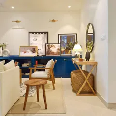A little peek into the living room of the Breeze Home. This shot shows how I balance bold elements, like the blue bookcase, with quieter, neutral pieces to create a space that is warm, inviting, and full of personality.