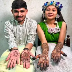 We love creating matching designs for the bride and groom. This couple's mehndi features detailed bridal figures for her and the couple's names and a special verse for him.