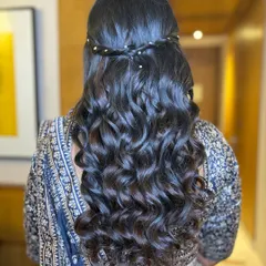 Gorgeous waterfall curls. This romantic hairstyle is perfect for showing off long hair and adds a soft, flowing texture that looks beautiful with both lehengas and gowns.