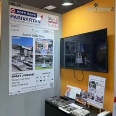 Our booth at Startup Mahakumbh, located in the HDFC Parivartan pavilion. The display features a poster detailing our Smart Solar Huts and a screen showcasing our product in action, ready to welcome visitors.