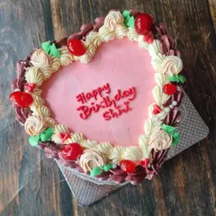 I finally made one of these ornately decorated vintage heart cakes. It's one of the few designs where more is more, with intricate piping, rosettes, and cherries.