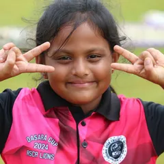 The pure joy and fun of cricket, captured in the smile of one of our youngest players.