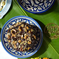 An overhead shot of my Ragi Chocolate Walnut Tea Cake, beautifully presented on a traditional blue pottery plate. It's a wholesome and nutritious option for festive gifting.