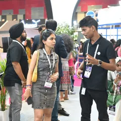 A member of our technical team explaining the intricacies of a system to an engaged visitor. These one-on-one conversations are where we can truly share the value and potential of smart home technology.