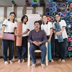 Pictured here with a group of dedicated students. It is rewarding to guide individuals as they deepen their practice and embrace yoga as a tool for life.