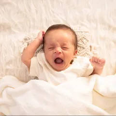 A big morning yawn. I capture all the little moments, even the unposed ones, as they show your baby's budding personality.