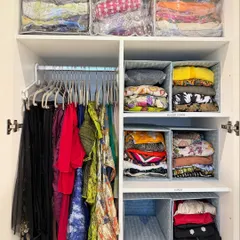 We create zones for different types of clothing. Here, hanging items are separated from folded clothes stored in bins and clear-front bags, creating a system that's easy to navigate.