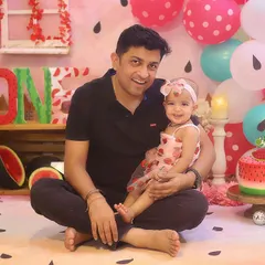 A proud dad with his 'one in a melon' little girl. Capturing these sweet parent and child moments during a cake smash session is just as important as the cake itself!