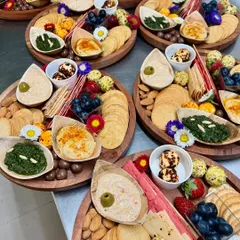 A collection of our individual cheese and dips platters, prepared for a corporate event. Each platter is a perfect single-serving graze, beautifully arranged with a variety of textures and flavours.