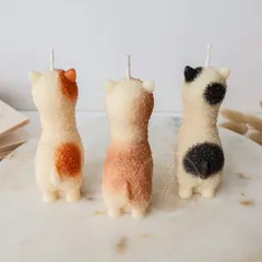 The back view of the Alpaca candles, showing the little spots I paint on each one by hand.