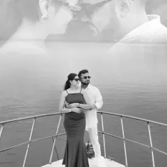 A black and white photo of the couple on a yacht, with a dreamy double exposure effect. This creates a timeless and artistic memory of their Goa pre-wedding shoot.