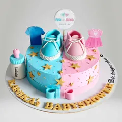 A duplicate of the popular heart-shaped gender reveal cake, perfect for a baby shower. The design includes a baby bottle and tiny clothes to add to the cuteness.