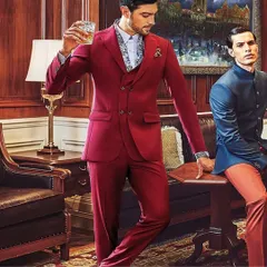 This shot from the SPAADAA 2021 campaign highlights a bold approach to formalwear. The vibrant red three-piece suit, paired with a patterned shirt, is styled to convey confidence and modern elegance in a classic setting.