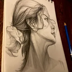 A random practice session sketching a woman's profile. I love capturing the way hair flows and the subtle expression on a person's face.