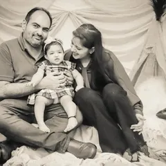 A classic family portrait with a soft, dreamy feel, enhanced by a monochrome treatment.