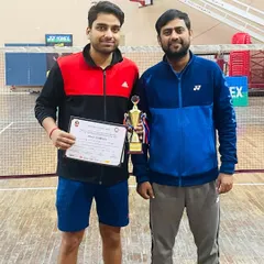 A closer look at the U.P. Senior State men's doubles champion, Himanshu Mittal, with his trophy and certificate. This is the result of countless hours of focused practice.