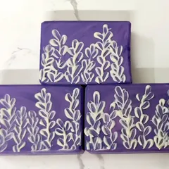 This was my attempt at a brush embroidery technique for a soap challenge. I piped soap onto the finished bar and used a brush to create this lavender design. It was a challenge, but a great learning experience.