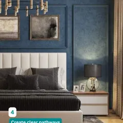 We create clear pathways to make your bedroom feel open and uncluttered. This luxurious design uses a bold blue accent wall and elegant lighting to create a sophisticated mood.