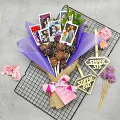 Our personalized cake pop bouquets are one of my favorite things to create. This one features rich chocolate cake pops and a collection of the client's favorite photos, making it a truly unique and heartfelt gift for Raksha Bandhan or any other celebration. It’s more than a dessert, it’s a bouquet of memories.